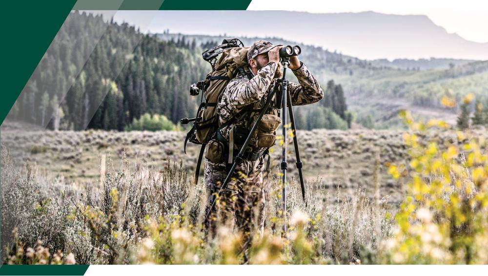 Hunter glassing with the Ridgeview™ Carbon Tripod in a western hunting landscape.