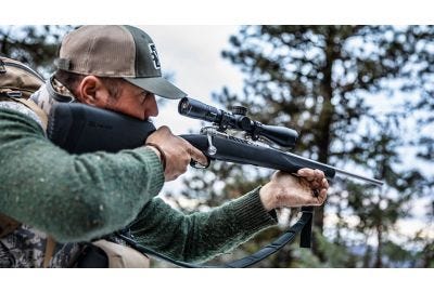 Hunter shooting off hand while hunting.