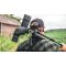 Man carrying the Vortex® Crossfire® HD Spotting Scope across a field.