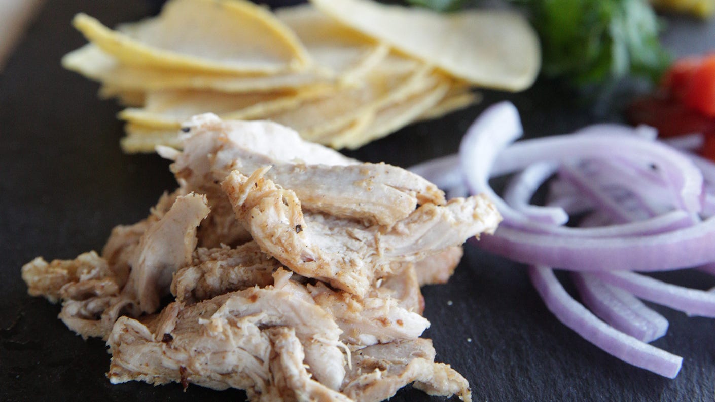 Shredded dove and sliced vegetables on the platter