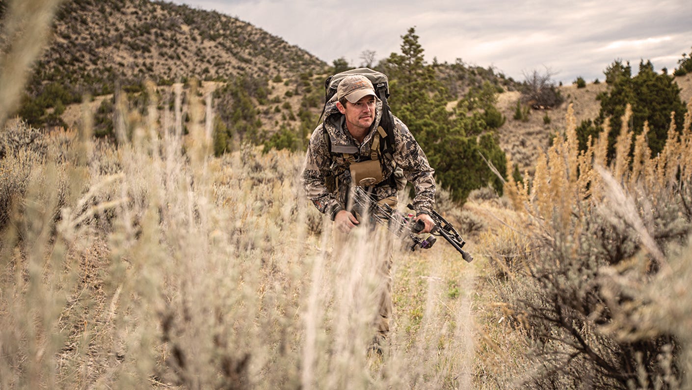 A hunter referencing his map and landmarks throughout his stalk to track his progress