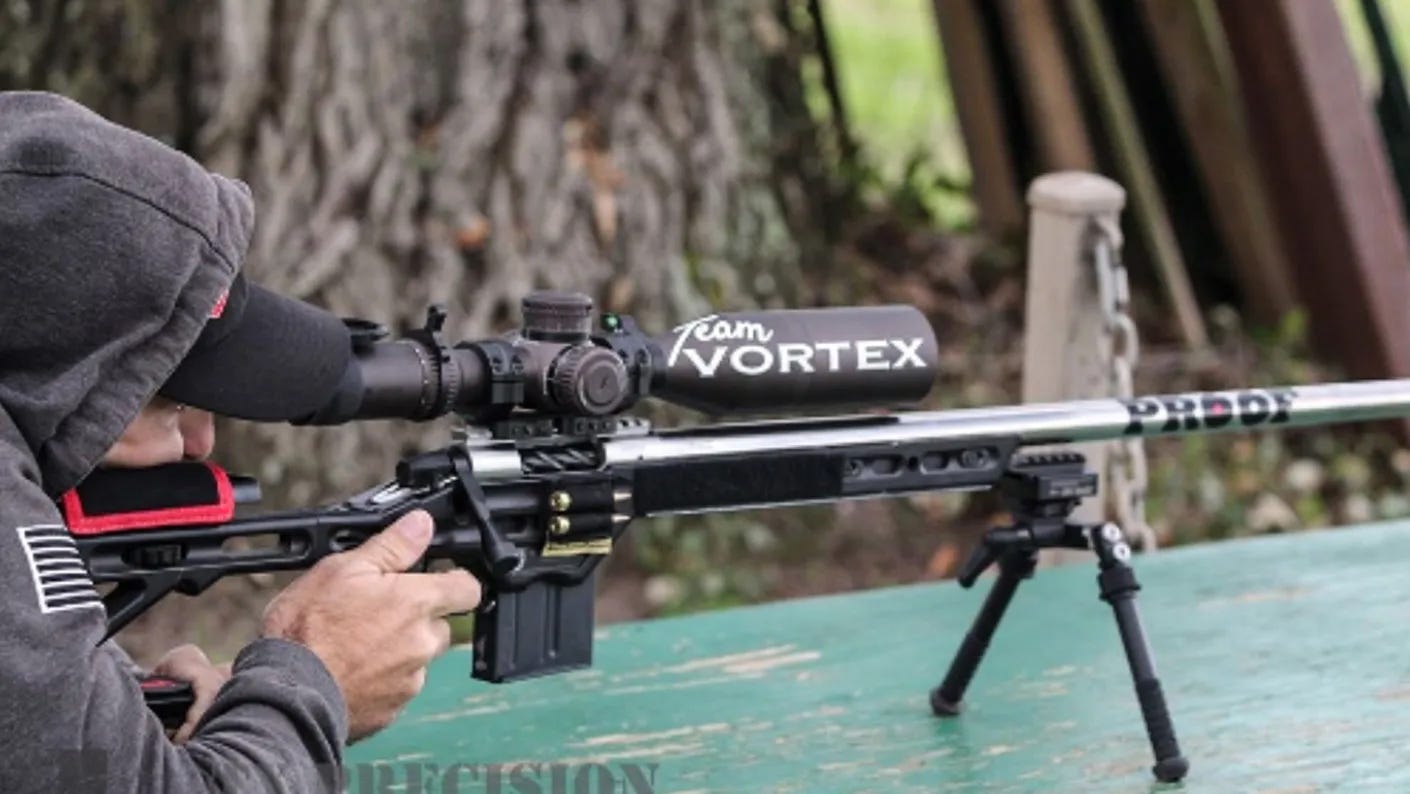 Competitive shooter Tucker Schmidt performing at a gun competition.