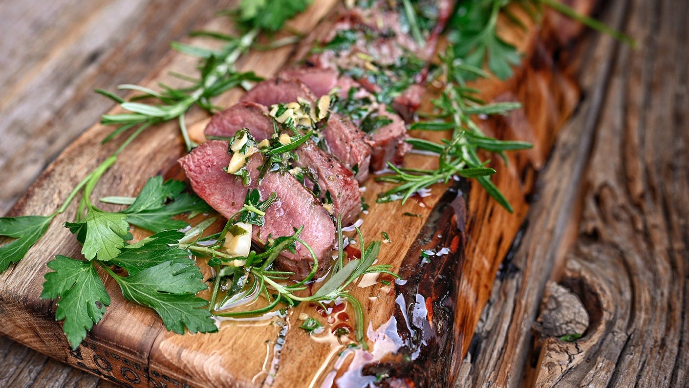 Herb & Garlic Butter Venison on a platter.